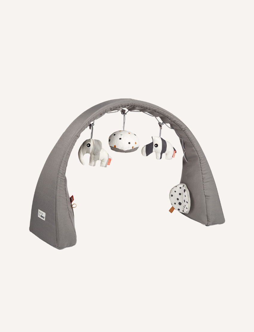 Grey activity gym with hanging plush elephant, striped zebra, and speckled ball for baby play