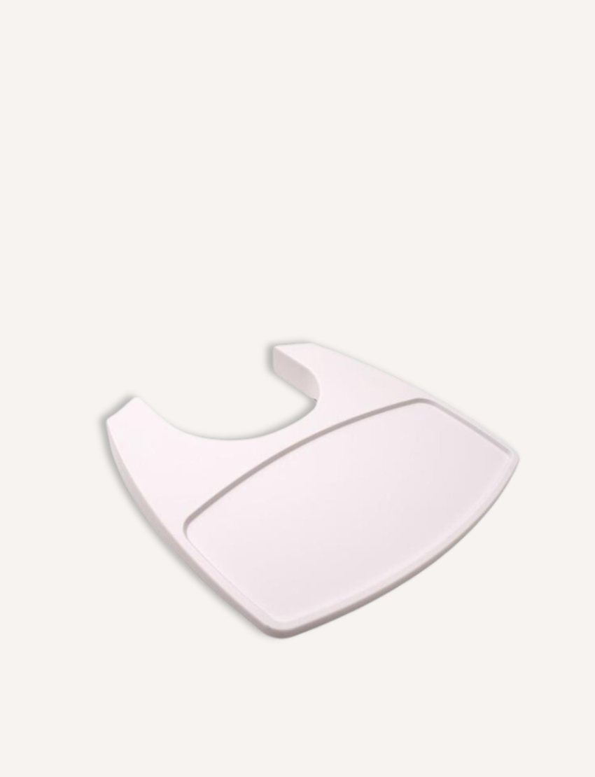 Close-up of a white detachable tray for a high chair.