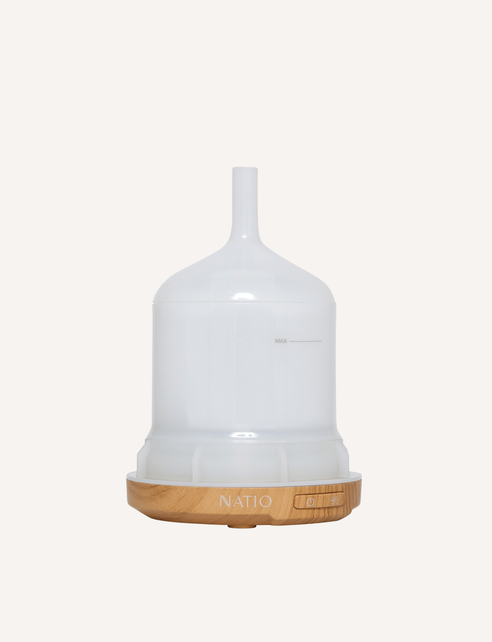 Empty white ultrasonic diffuser with a wood base and controls.