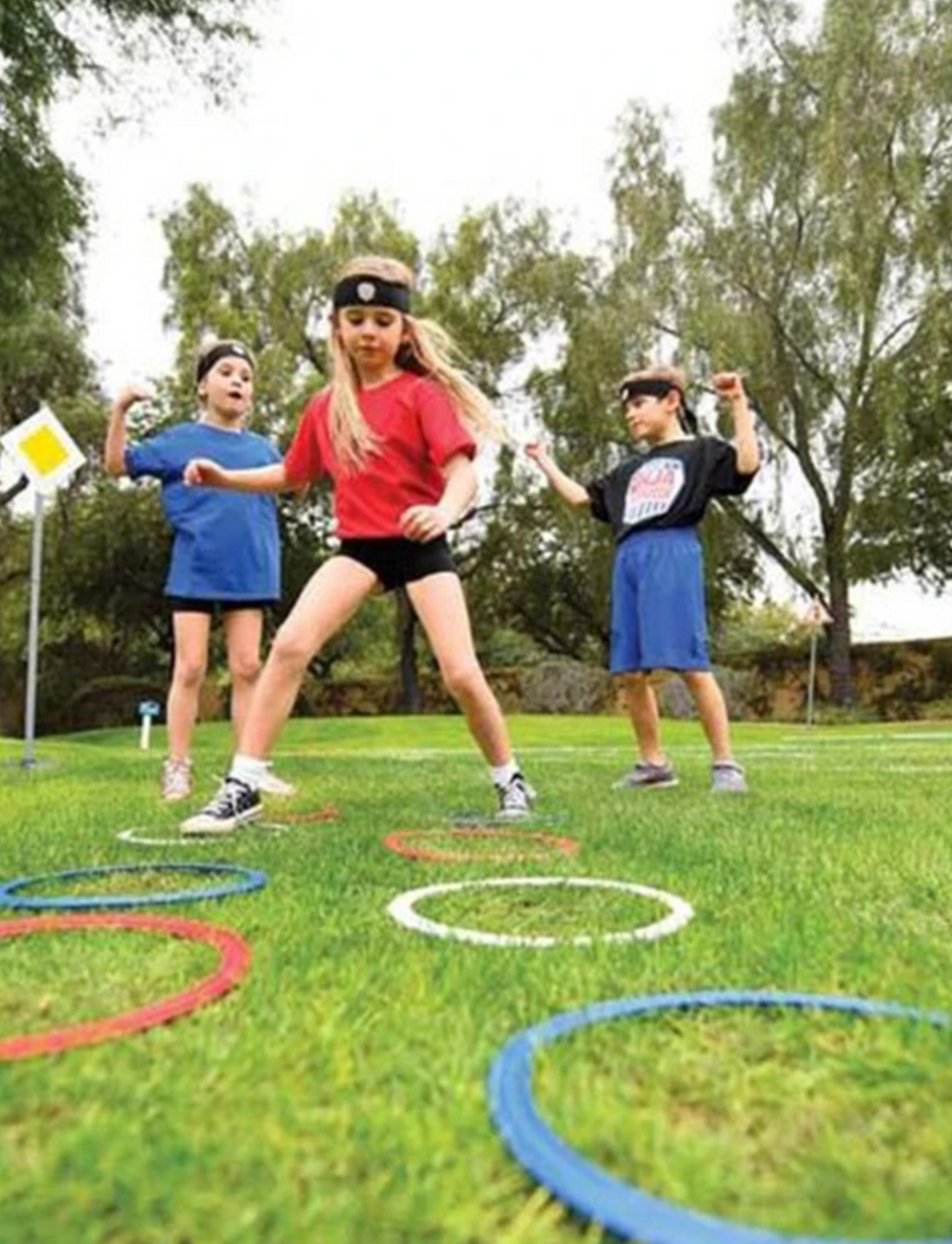 Slackers Ninja Obstacle Course set including two hopper balls, agility rings, rope, poles, and a purple carry bag.