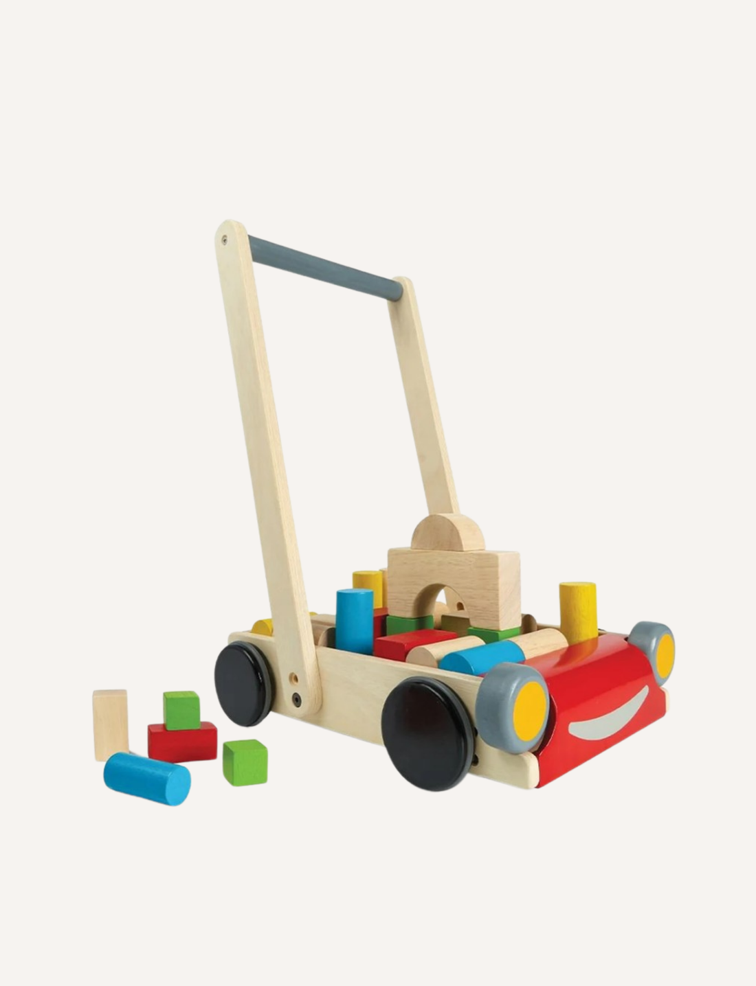 Wooden baby walker designed as a red car, filled with colorful building blocks, on a light background.