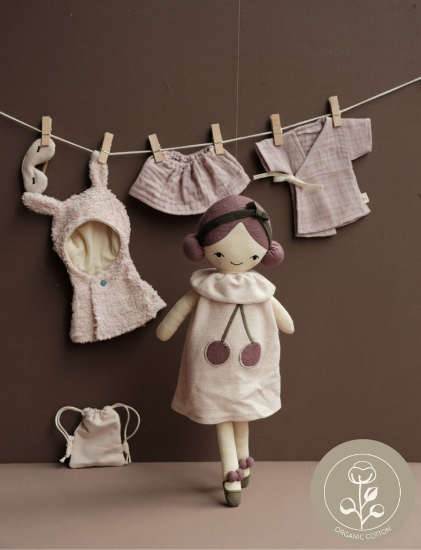Plush doll 'Cherry Pie' with clothing hanging on a line, plus accessories