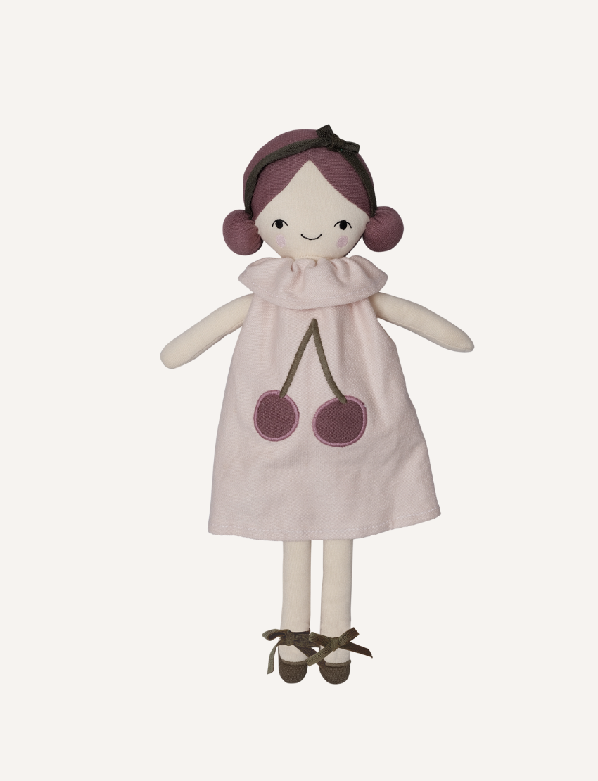 Plush doll with braided hair, brown dress, and lace-up boots