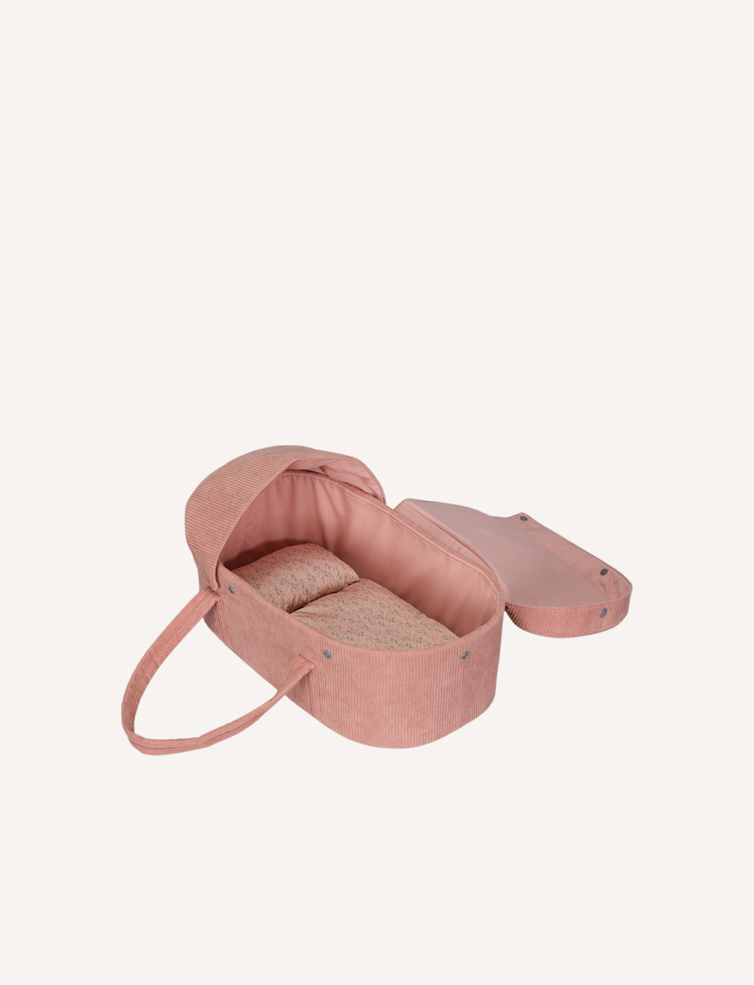 A vintage-style pink corduroy doll carrycot with a comfortable interior, perfect for a favorite doll.