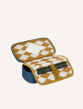 Open pink pencil case with checkered lining, holding red and orange pencils.
