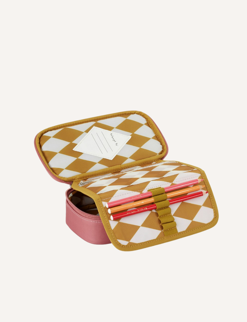 Open pink pencil case with checkered lining, holding pencils.