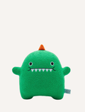 Green plush dinosaur toy with embroidered face, orange spikes, and a small brand tag.
