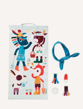 A light blue fabric game poster with farm animal characters and separate accessory pieces, including a blindfold.