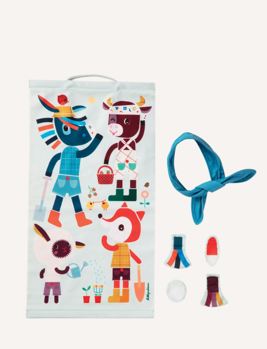 A light blue fabric game poster with farm animal characters and separate accessory pieces, including a blindfold.