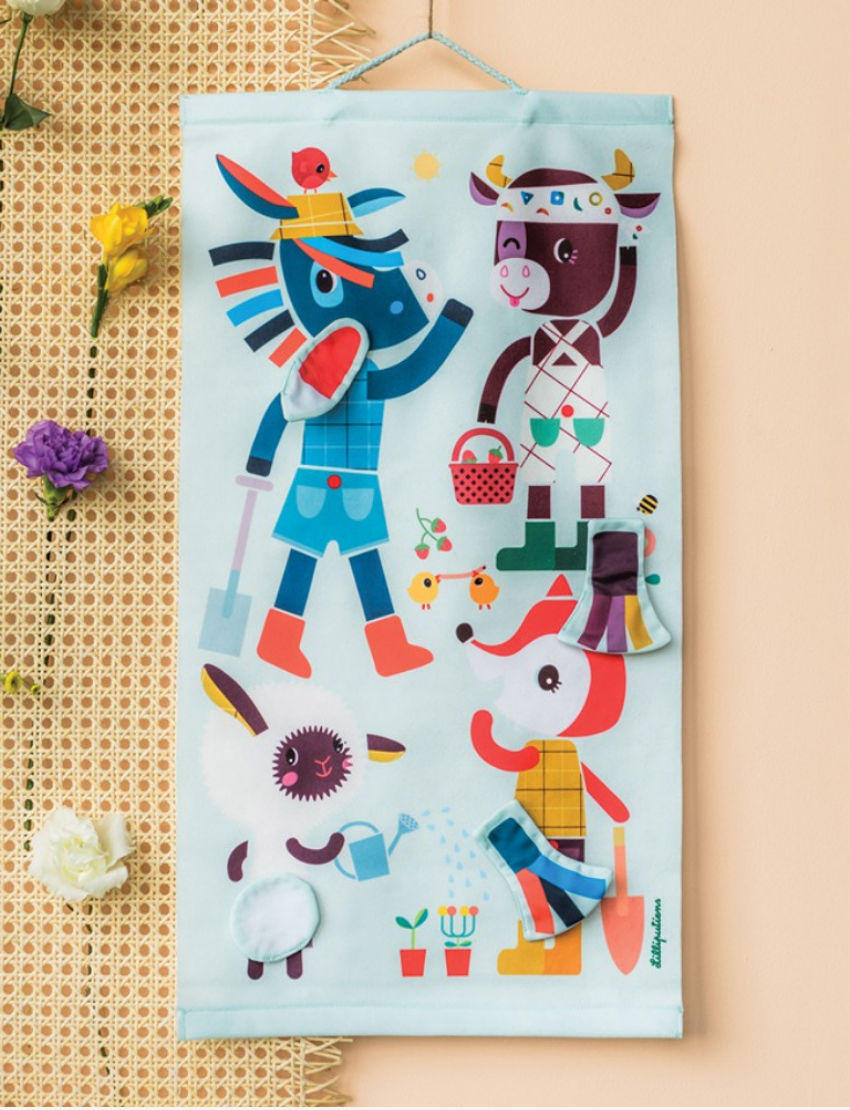 A light blue fabric game poster featuring characters like a donkey, cow, and fox, with colorful elements.