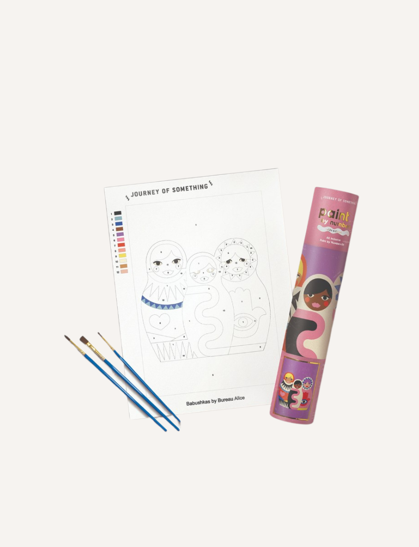 Paint by Numbers kit for kids including a canvas with Babushka dolls, paint pots, brushes, and a cylindrical storage tube.