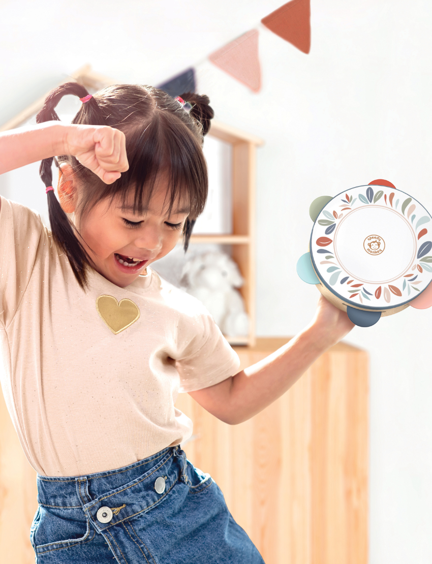 Speedy Monkey wooden tambourine with a colorful leaf pattern and pastel jingles.