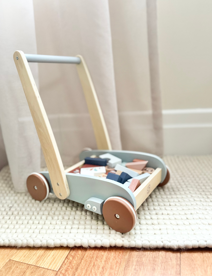 Wooden block walker with colorful blocks, designed for babies learning to walk and play.