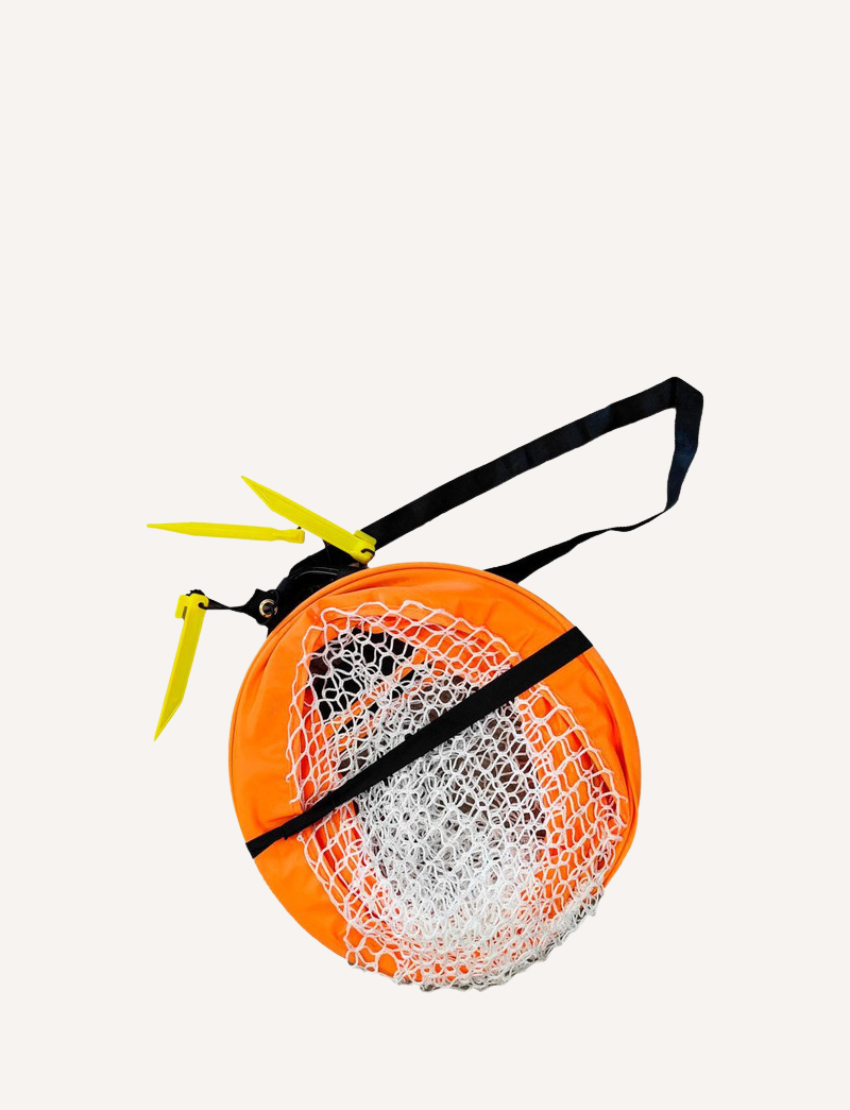 Set up Buffalo Sports pop-up soccer goal with a bright orange frame and white net, ideal for training, practice, or backyard play.