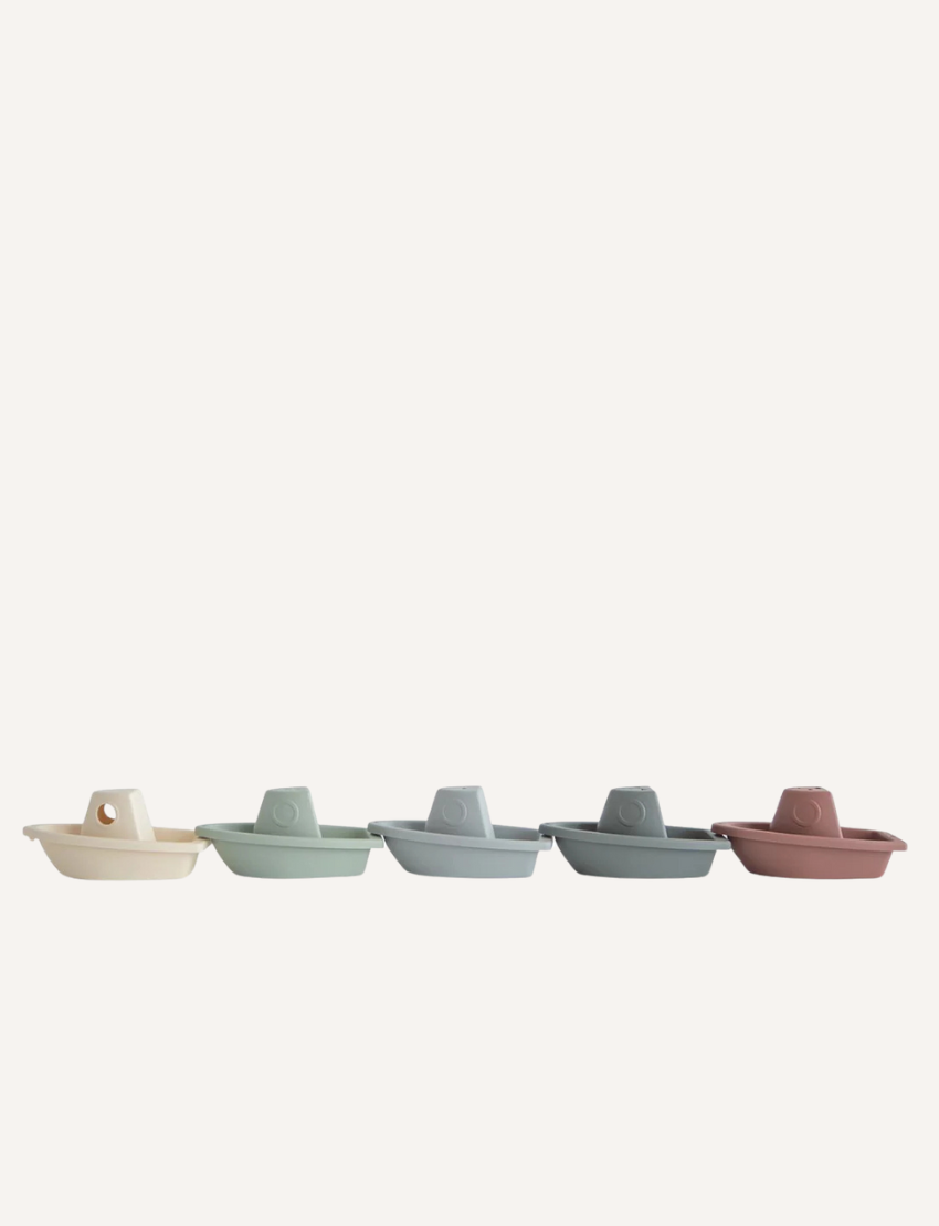 Five soft, pastel-colored toy bath boats aligned in a row. Perfect for engaging water play, sensory exploration, and imaginative fun for kids.