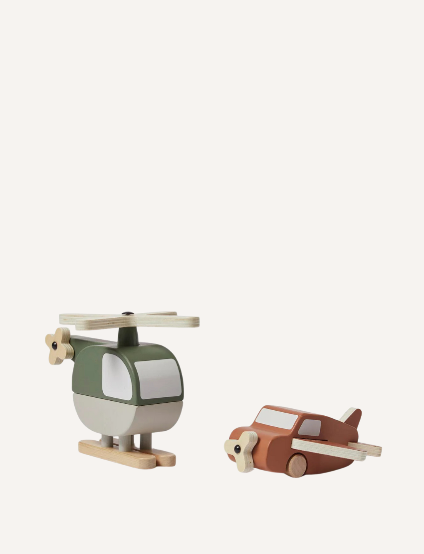Green and brown wooden helicopter toy and brown airplane toy displayed on a white background.