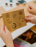 Child's hands stamping messages like