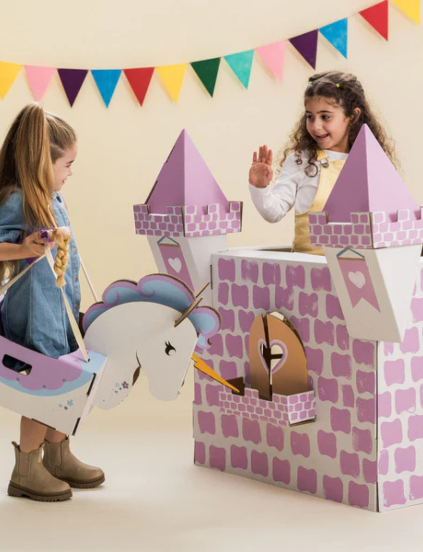 An unpainted, white cardboard castle playhouse kit, featuring turrets and archways. Perfect for creative DIY decoration.