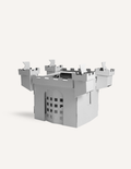 Cardboard castle craft kit with flags and drawbridge, ready for imaginative play.