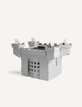 Gray cardboard castle with open gate and battlements, displayed on a white background.