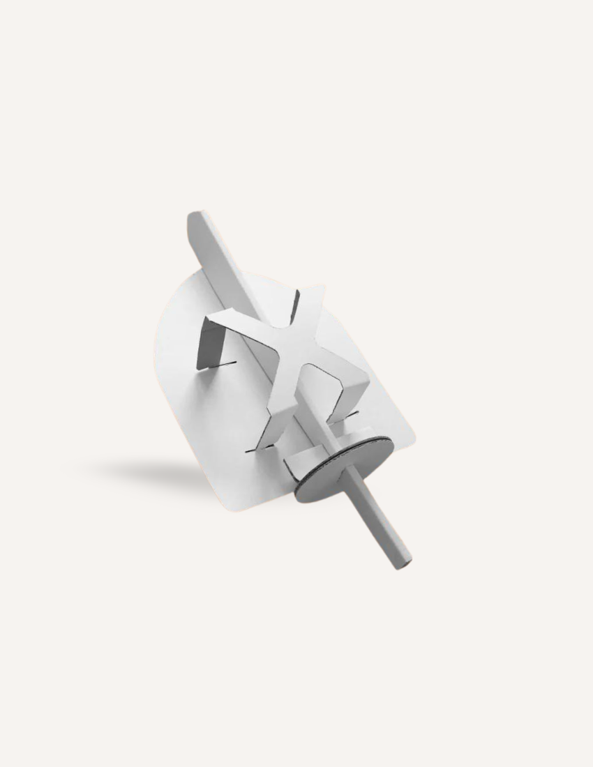Cardboard spinning toy with a propeller-like design, displayed on a white background.