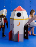 Children playing with a cardboard rocket ship and a space shuttle costume. Creative DIY project and imaginative space play.