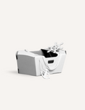 White cardboard 3D boat model with a ship's wheel and anchor detail.