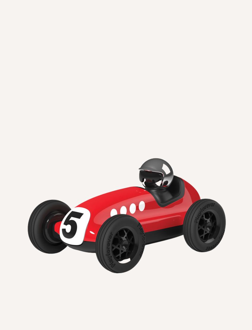 Red vintage toy race car with number 5, black wheels, and a driver in a helmet, displayed on a white background.