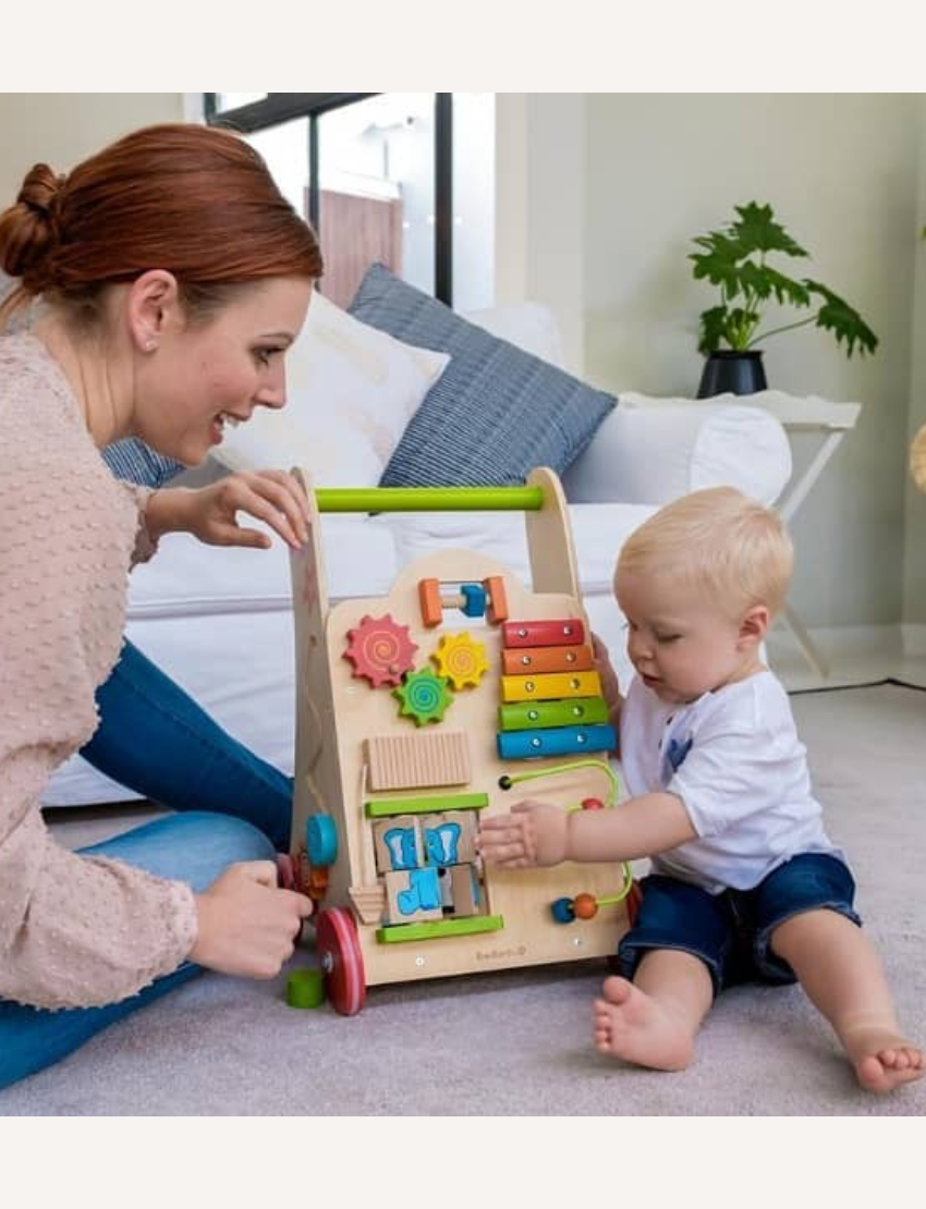 Wooden baby walker with multiple activity stations, including xylophone, gears, and bead maze.