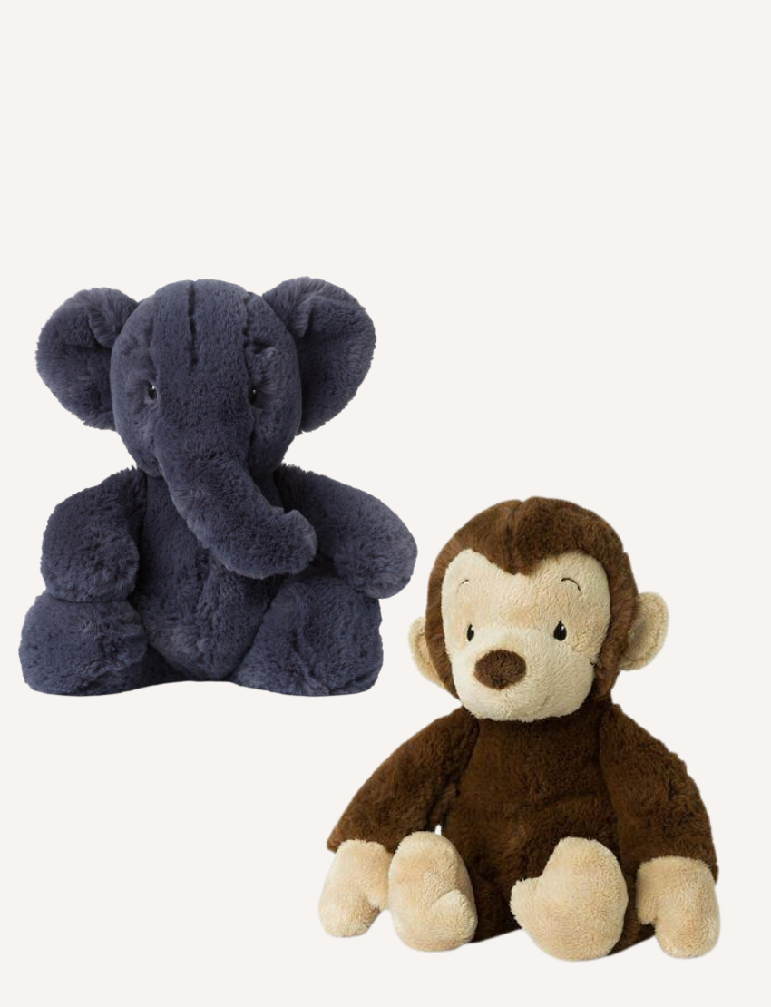 Plush dark grey elephant and a plush brown monkey sitting side by side on a white background.