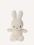 A soft, cream-colored Miffy plush toy with its signature X-shaped mouth, sitting on a white background.