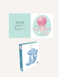 Children's book pages with illustrations of a pink jellyfish and a blue dolphin, describing their features.