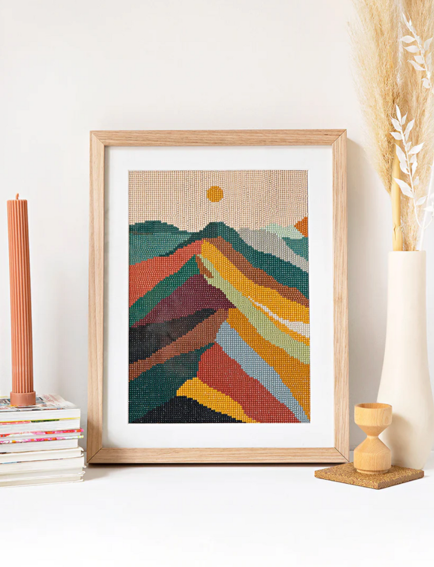 Diamond painting kit with pink landscape, drills, and tool