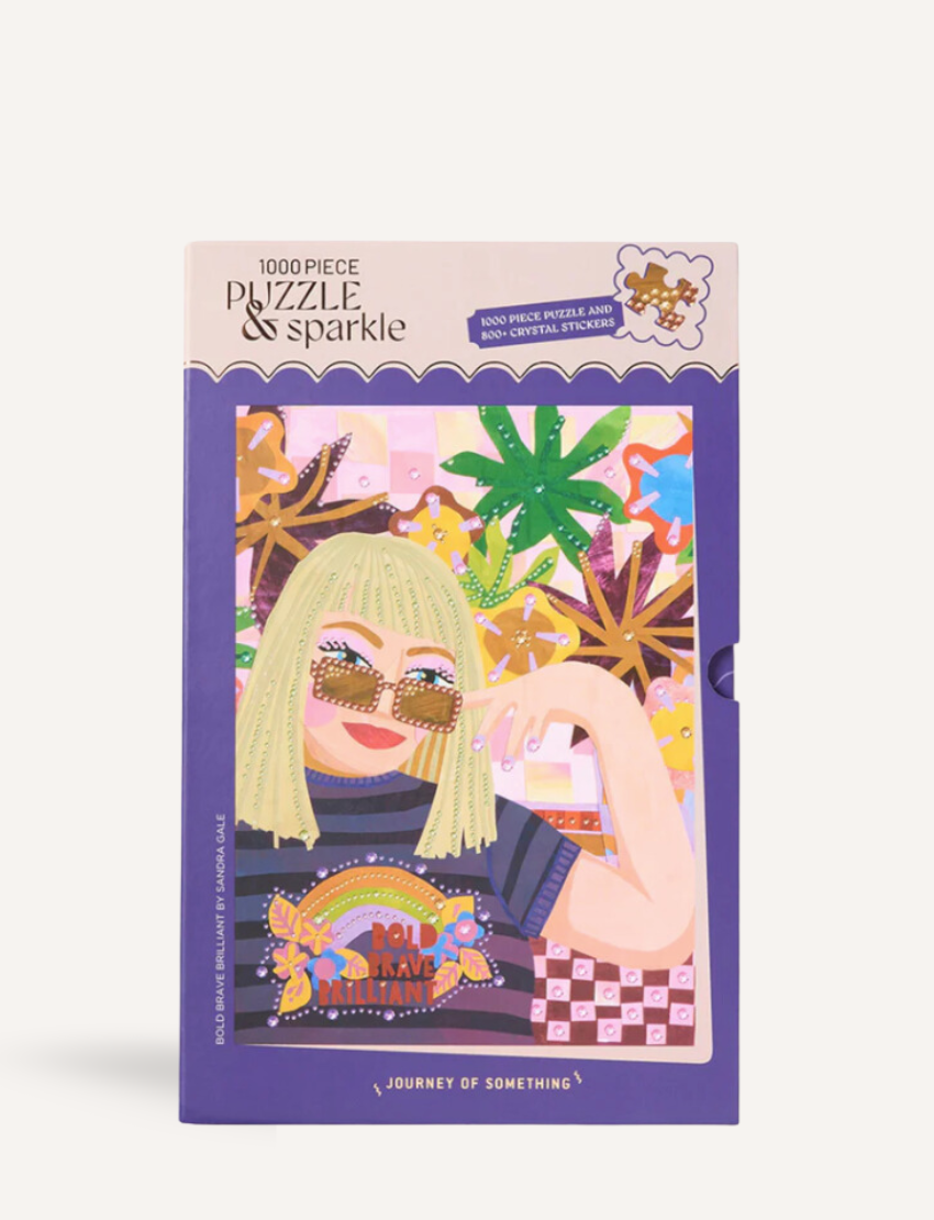 Box for '1000 Piece Puzzle & Sparkle' featuring a stylish woman and rainbow design.