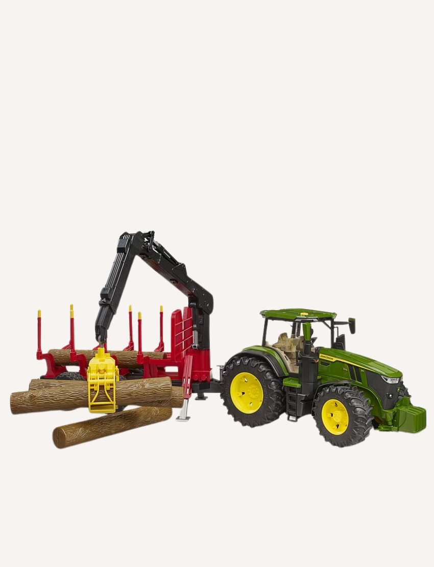 Green John Deere tractor with a red log trailer, crane is grabbing logs.