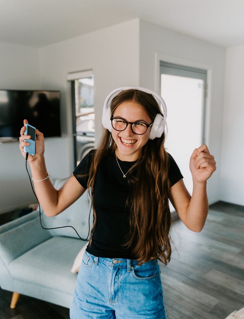 An open The Play Way Reflection Kit, featuring therapist-designed tools like books and an MP3 player for emotional regulation.