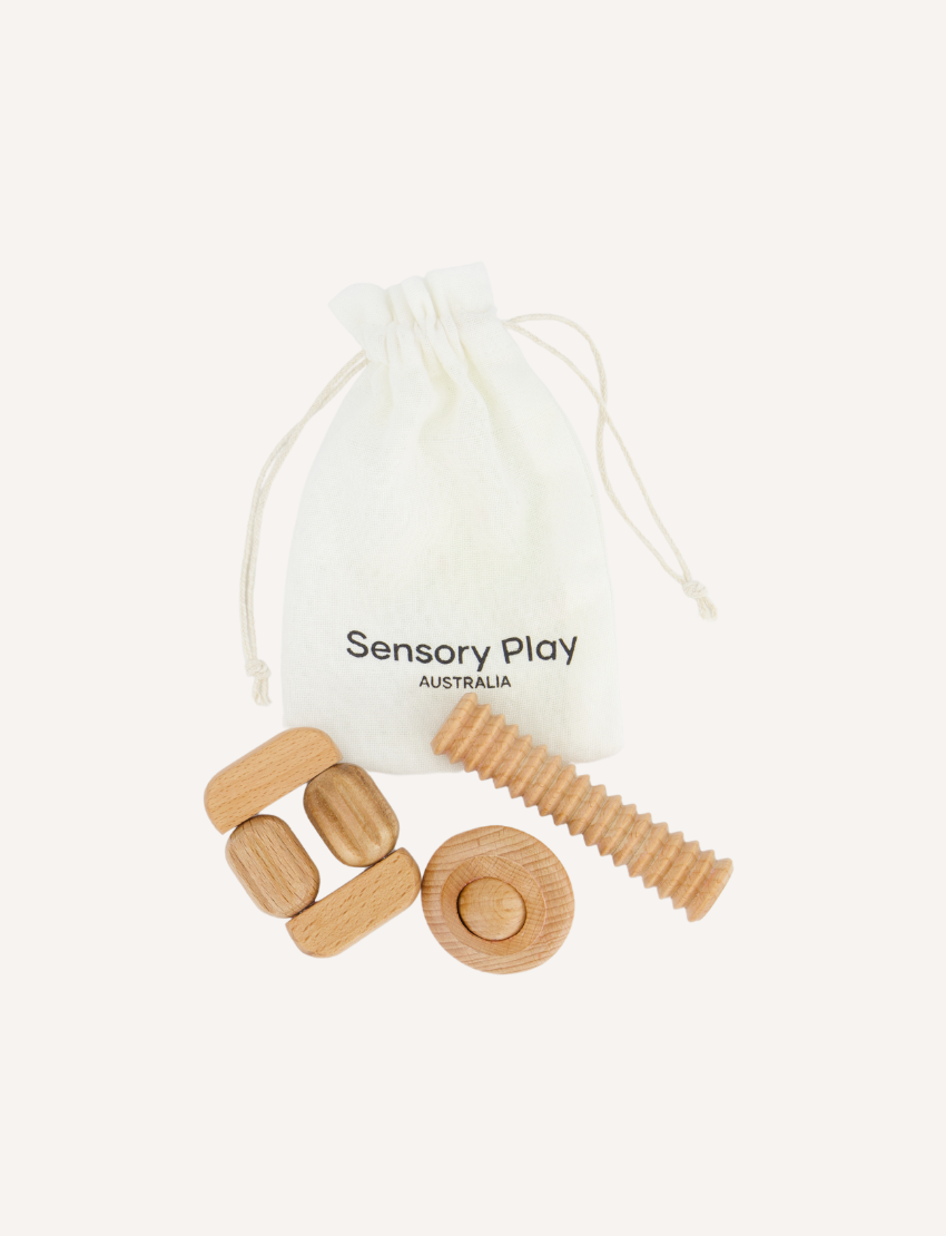 The Play Way Regulation and Reflection Kit features natural wooden sensory tools including fidgets and massagers, with a branded bag, supporting emotional regulation.