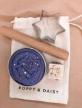 Poppy & Daisy natural playdough kit with purple glitter playdough, star cutter, roller, and stamp.