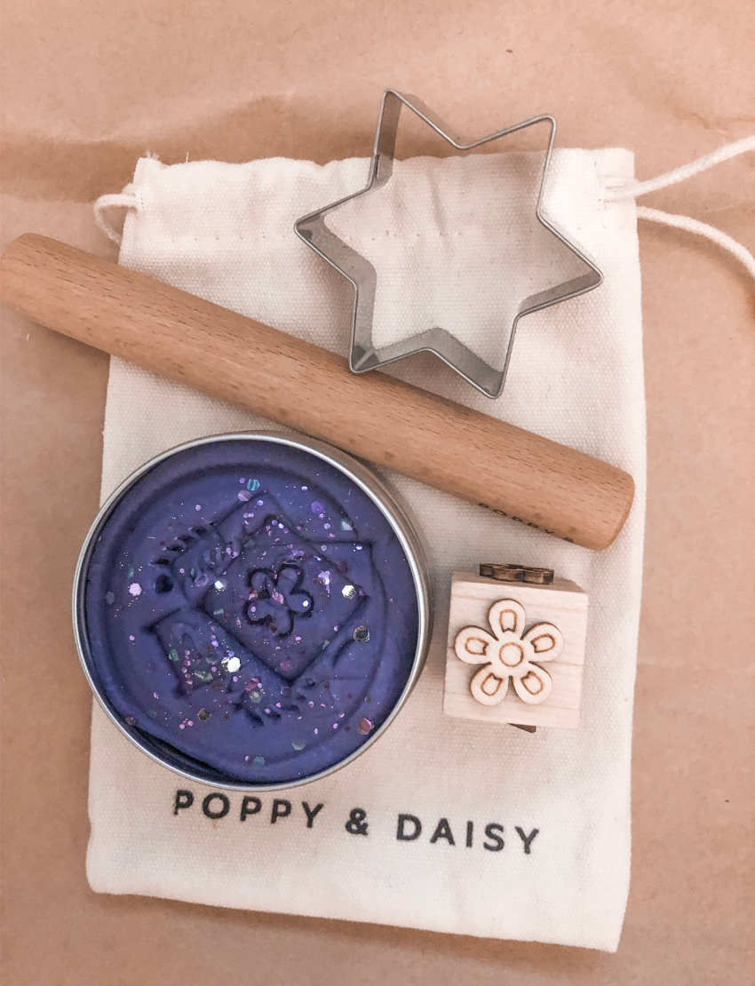 Poppy & Daisy natural playdough kit with purple glitter playdough, star cutter, roller, and stamp.