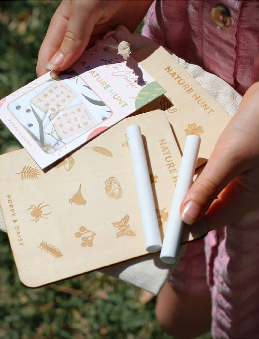 Poppy & Daisy Nature Hunt activity kit with wooden boards, chalk, and cotton drawstring bag.
