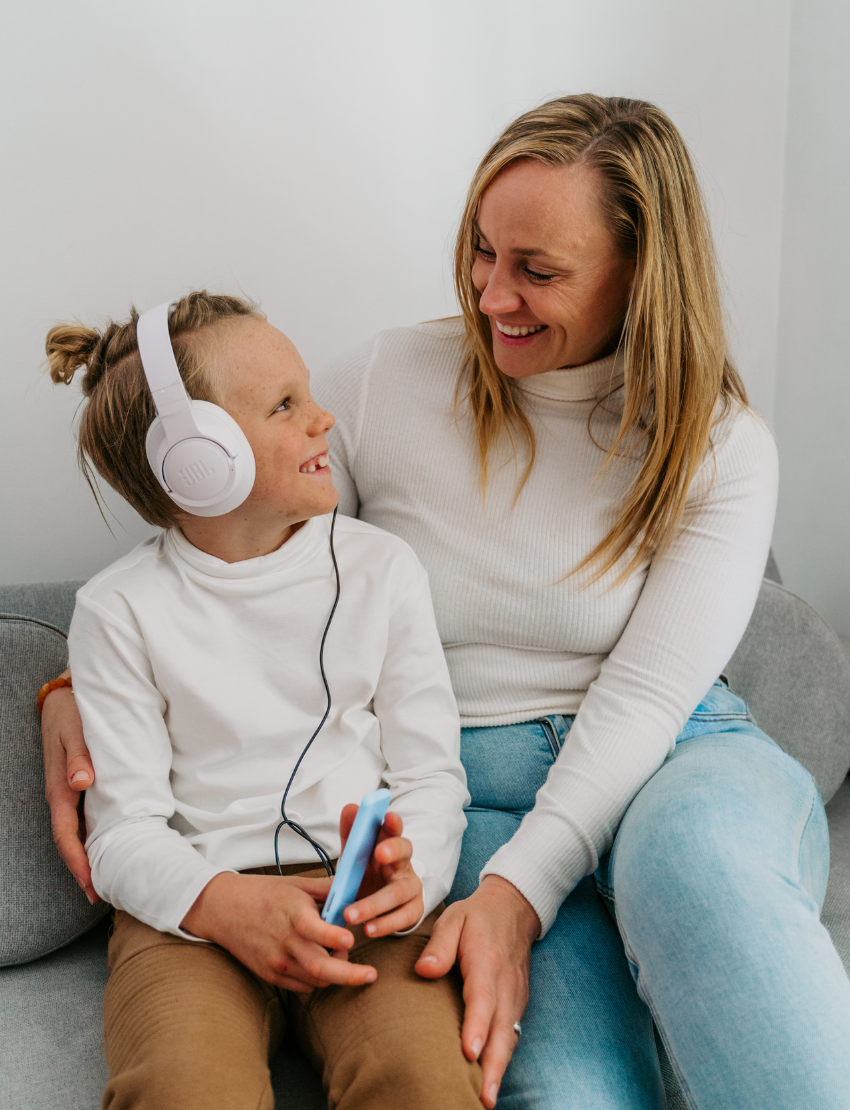 The Regulation: Discovering your Calm Program by Therapy At Home features a teal box with colorful shapes, a blue bag, children’s book, regulation cards, yellow ball, toy phone, pacifiers, bottle nipples, and gray pacifier holder on a light background.