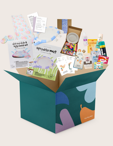 The Therapy At Home "Regulating the Nervous System through Sensory Play Program" is a large green and blue box with visible packaging. It includes sensory toys, sunscreen, snacks, slip and slide set, sprinkler mat, art supplies, and hygiene items for kids.