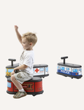 Children playing with Italstrike Ride On ambulance, police, and fire truck toys.