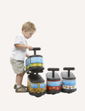 Child playing with Italstrike Ride On train toys, stacking them.