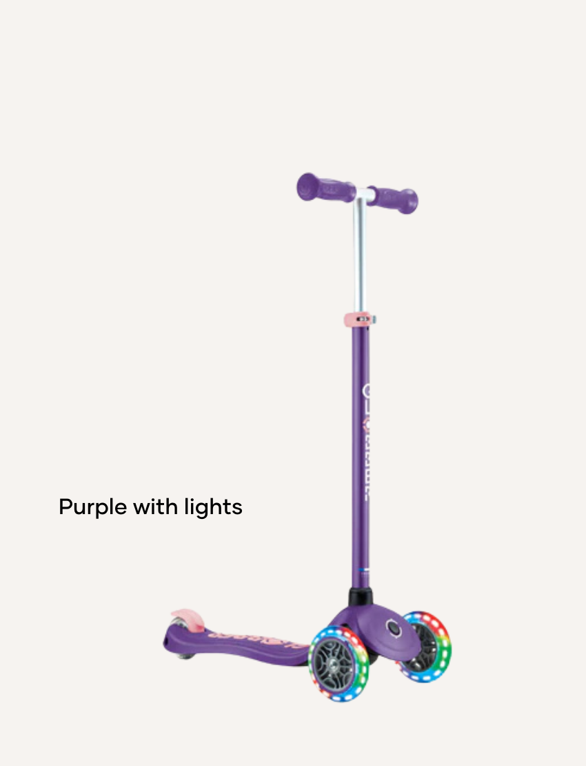 Kids' scooters and helmets in blue, teal, and pink. Safety gear for active outdoor play and fun rides.