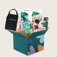 The Creative Mindfulness: Mandalas Program by The Play Way includes a vibrant open box with markers, colored pencils, notebooks, paint, a tote bag, and crafting materials. It has abstract green, purple, and orange patterns with "The Play Way" text.