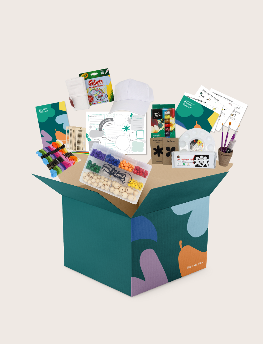 The Express Yourself Program by Therapy At Home features a teal and purple box with paint, markers, brushes, worksheets, bead kit, colored paper, a white cap, and a paint palette—perfect for occupational therapy activities.