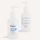 Two bottles of Melo's Melo Conditioner are displayed. One bottle faces forward, showcasing the product label, while the other faces backward, displaying the ingredient list and information. Both bottles, designed for babies with a gentle formula, feature white pumps and are paraben-free.