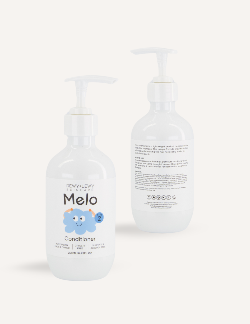 Dewy+Lewy Skincare Melo Conditioner bottles, white pump bottles with cute duck graphic branding.