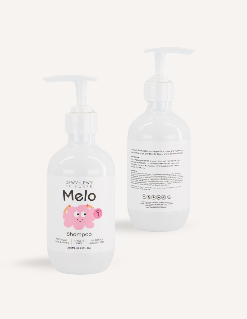 Dewy+Lewy Skincare Melo Shampoo and Conditioner bottles, white with playful branding for kids.